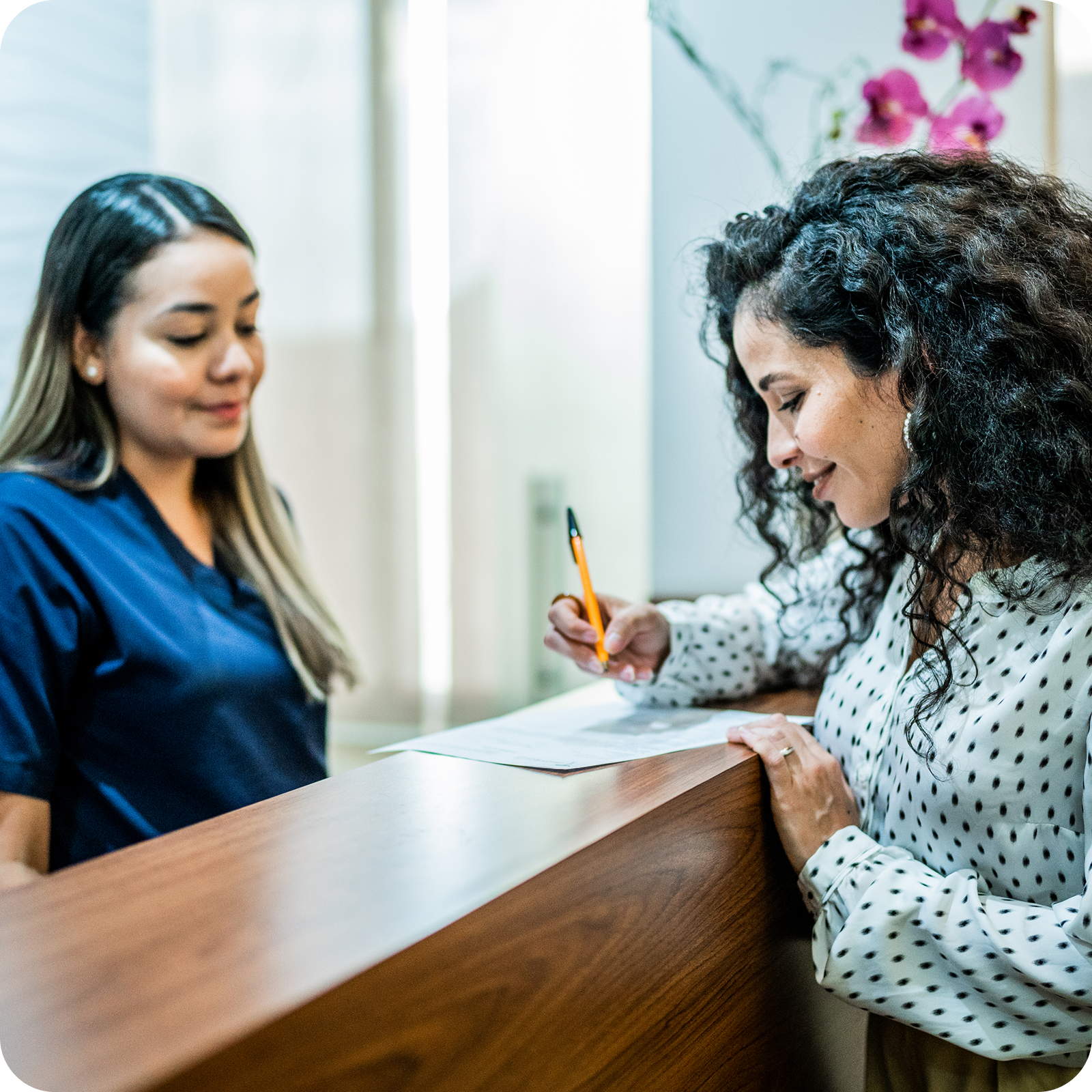 Patient reviewing pre-operative instructions with a healthcare coordinator