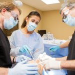 Oral Surgeon and staff with a patient